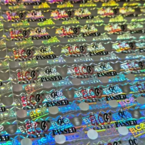 สติกเกอร์กระดาษกาวพิมพ์สองสี โฮโลแกรมสีเงิน พร้อมหมายเลขเลเซอร์ ดีไซน์โฮโลแกรม ยี่ห้อ Digitech - Product Image 1