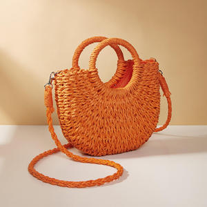 Complementa tus atuendos para el clima soleado con este encantador bolso de hilo natural con una silueta curva marrón y asas, disponible hoy. - Product Image 5