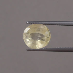 พลอยแซฟไฟร์สีเหลืองทรงรีขนาด 10.5x10 มม. น้ำหนัก 5 กะรัต ได้รับการรับรองจาก IGI แท้ 100% ผ่านการเคลือบแว็กซ์/น้ำมัน เพิ่มสีสันสวยงาม - Product Image 1