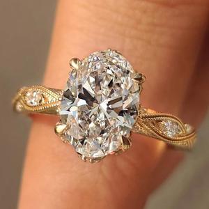 Bague de fiançailles classique en or avec diamant taille ovale vintage et sangle milgrain ornée, bijou de mariée élégant, style antique, luxe - Product Image 1
