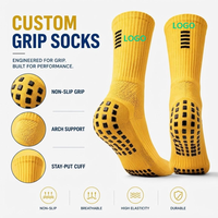 Chaussettes de football personnalisées à forte valeur ajoutée Chaussettes à prise en main d'usine Chaussettes antidérapantes