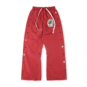 กางเกงแทร็คขายาวทรงหลวมสไตล์สตรีทแวร์สำหรับผู้ชาย กระดุมแป๊ก ผ้าไนลอน มีเชือกผูกเอว ปักลายปะติด รับผลิตแบบ OEM ขายส่ง - Product Image 6