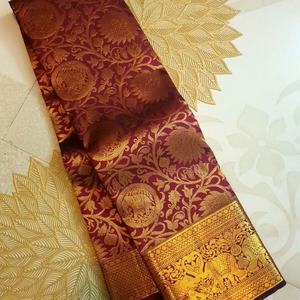 Fancy Banarasi Soft Silk Weave Work <b>Saree</b> with Unstitched Blouse in <b>Maroon</b> - Product Image 1