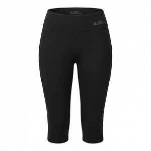 Pantalon de yoga taille haute mi-mollet pour femme North Approach, noir uni, extensible dans quatre directions, avec poches, design sans coutures - Product Image 1