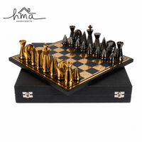 Jeu d'échecs en laiton noir et or durable pour enfants avec pièces sculptées coniques, plateau à damier et étui de rangement