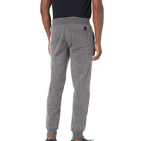 Fabrication en usine de pantalons de jogging pour hommes, grandes tailles, coupe évasée, avec cordon de serrage.