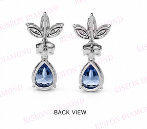 Exquisitos pendientes de joyería fina en oro blanco de 18 quilates con piedras centrales azules reales de corte pera, adornados con marquesa y ovalados. - Product Image 3
