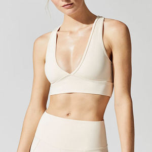Soutien-gorge de sport pour femme à col en V profond et dos nageur, maintien moyen, respirant, sans coutures, pour yoga et activités sportives, couleur unie - Product Image 1
