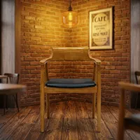 Chaise de restaurant moderne en velours et bois avec dossier incurvé, accoudoirs, siège rembourré noir et pieds en métal pour hôtel et salon