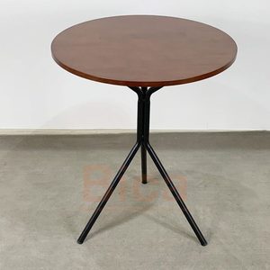 Table basse ronde en pierre de style industriel durable avec base en métal noir minimaliste pour salon contemporain - Product Image 1