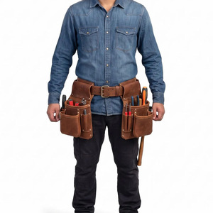 Cinturón organizador de herramientas de cuero genuino con múltiples bolsillos, costuras reforzadas y presilla para martillo, en venta a bajo precio. - Product Image 1