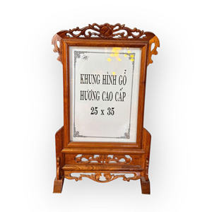 The picture <b>frame</b> is made of fragrant wood, with a simple design and dimensions of 25x35 cm. - Product Image 1