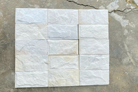 Meilleure offre Pierre naturelle blanche laiteuse Carreaux muraux bruts à face fendue Panneaux de revêtement décoratifs pour l'extérieur et l'intérieur d'une villa de villégiature