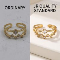 Bague ouverte classique en acier inoxydable plaqué or 18 carats avec double couche de zircons, sertissage en canal et détail étoile – Vente en gros