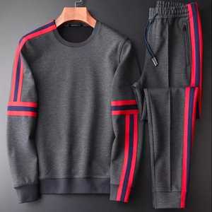 Pantalon de survêtement gris pour homme avec rayures rouges et bleues, taille élastique, poches latérales, tenue décontractée d'automne, coupe régulière, longueur complète - Product Image 1