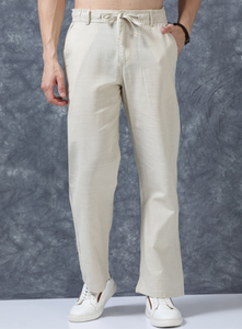 Premium Cotton <b>Trousers</b> <b>For</b> <b>Men</b> Beige Solid Relaxed Fit Mid Rise Regular Pants With <b>Elasticated</b> Waistband And Drawstring Closure - Product Image 1