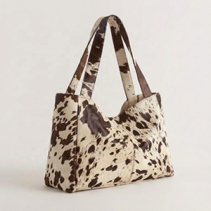 Sac fourre-tout unisexe en cuir véritable à imprimé vache, grande capacité, style hobo, avec poignée souple et fermeture éclair, sac à bandoulière tendance pour le quotidien - Product Image 1