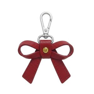Accesorio de lujo personalizado con lazo rojo y anillo metálico brillante para promoción de joyería, llavero de cuero PU con lazo y dijes. - Product Image 1