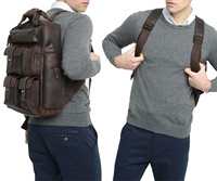 Sac à dos en cuir grande capacité avec grande poche principale zippée et 5 poches avant, idéal pour les voyages en plein air