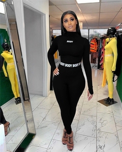 Mono de mujer negro de cintura alta con cuello alto y manga larga, estampado corporal, ajuste ceñido, de elastano y poliéster, estilo urbano. - Product Image 1