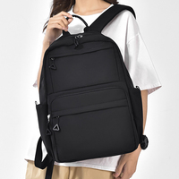Sac à dos unisexe noir en nylon grande capacité avec port de chargement USB, fermeture éclair, doublure en polyester, idéal pour les voyages, l'école et l'usage quotidien