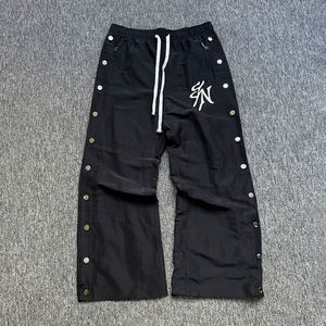 Pantalones cortavientos personalizados para hombre, de pierna ancha, con broches laterales, estilo hip hop, streetwear, holgados, de nailon, para entrenamiento. - Product Image 1