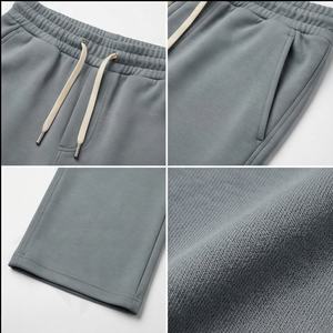 Alta calidad logotipo personalizado Color sólido en blanco Casual transpirable ropa de calle algodón al por mayor cintura baja pantalones de chándal acampanados - Product Image 4