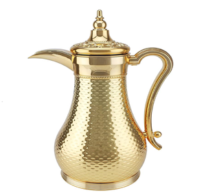 Regal copper <b>Arabic</b> dallah coffee pot featuring stunning dark floral carvings and a brass handle. Available at wholesale price. - Product Image 6