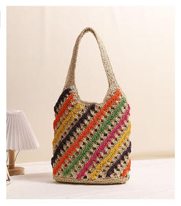 Ilumina tus días soleados con este vibrante bolso de hilo natural con coloridas rayas diagonales de crochet y asas cómodas. - Product Image 3