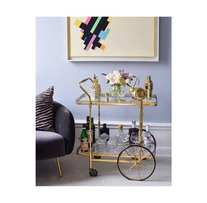 2 Tier Vintage Gold Bar Cart with Large Spoke Wheels Antique Gold Metal <b>Serving</b> <b>Trolley</b> with Mirrored Shelves - Product Image 1