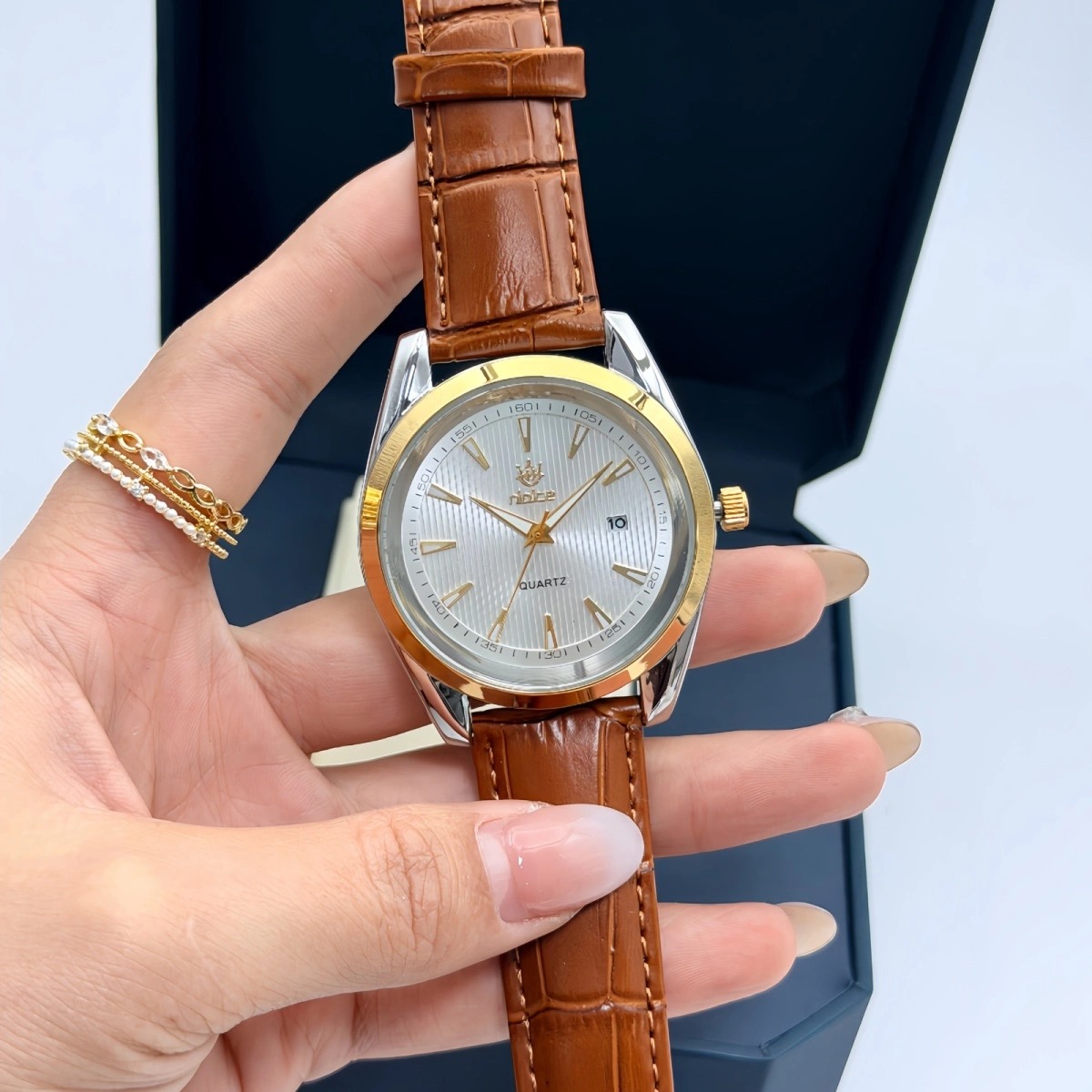 Brown strap with white dial