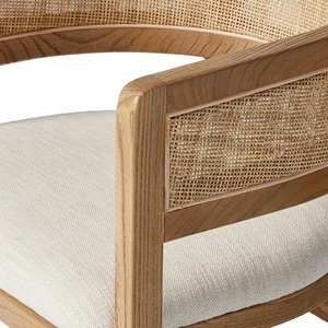 Esta es la silla de comedor Four Hands Cordoba, que tiene una estructura de madera de teca maciza en un color natural con un respaldo tejido de ratán. - Product Image 5