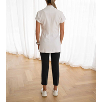 Tunique unisexe respirante en polyester, coton et élasthanne, avec logo personnalisé, de haute qualité, pour le secteur de la beauté, des salons de massage thaïlandais et les professionnels.