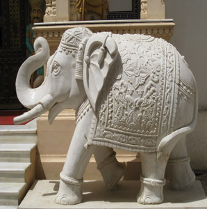 Intricately carved white marble <b>elephant</b> statue with traditional ceremonial blanket, available at wholesale prices. - Product Image 1