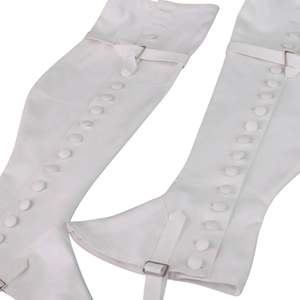 Estos son un par de polainas o protectores de piernas blancos y negros con cierres de botones plateados. - Product Image 6
