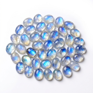 Venta al por mayor de piedras de luna arcoíris de 6x8mm, cabujones ovalados, gemas naturales de fuego azul con base plana para la fabricación de joyas - Product Image 1
