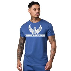 Camiseta deportiva con estampado gráfico azul real para hombre, cuello redondo, manga corta, atlética, para gimnasio, entrenamiento, ropa deportiva informal - Product Image 1