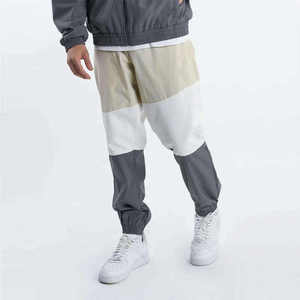 Chaqueta y Pantalones Deportivos Cortavientos Ligeros Unisex OEM para Invierno, con Logotipo Personalizado, Capucha y Estampado de Leopardo de Alta Calidad - Product Image 5