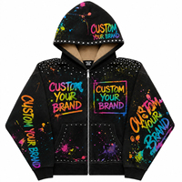 Sweat à capuche zippé noir surdimensionné pour homme, personnalisé, avec imprimé graffitis effet éclaboussures de peinture et clous, en molleton 100% coton, style streetwear tendance