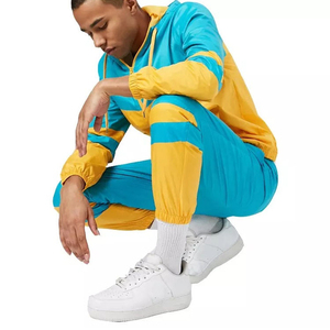 ผลิตเสื้อผ้ากีฬาขายส่ง ชุดวอร์มกันลมผู้ชาย โพลีเอสเตอร์ 100% ระบายอากาศได้ดี รับสกรีนโลโก้ตามแบบ ชุดกีฬาฤดูใบไม้ร่วง รับผลิตแบบ OEM - Product Image 1