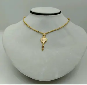 Exquisito Collar Chapado en Oro de 22K para Mujer con un Colgante en Forma de Corazón Texturizado y Cuentas de Oro con Corte de Diamante - Product Image 1