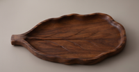Plateau de service en bois au design botanique unique, plateau en bois de mangue foncé avec forme de feuille et tige sculptée