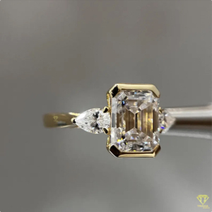 Elegant <b>Emerald</b> Cut Lab Grown Diamond Engagement <b>Ring</b> With Pear Side Stones In Yellow Gold For Women - Product Image 2