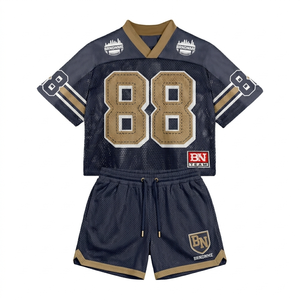 Conjunto de jersey y pantalones cortos de malla transpirable premium de 220 GSM para mujer, color azul marino con panel en contraste dorado y logotipo termotransferible. Conjuntos para mujer. - Product Image 1