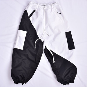 Two-Tone Black and <b>White</b> Waterproof Snow Pants with Multiple <b>Cargo</b> Pockets and Oversized Relaxed Street Fit - Product Image 1