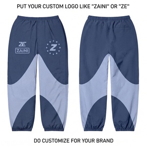 Pantalones Cortavientos Reversibles de Primera Calidad, Ligeros, 100% Algodón, Diseño de Paneles en Color Azul Marino y Gris, Logotipo Personalizado con Impresión Serigrafiada, Elásticos - Product Image 1