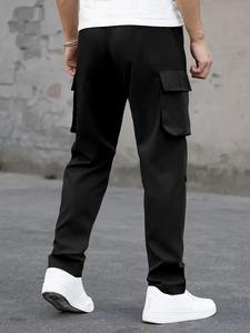 Pantalon cargo classique avec taille réglable par cordon de serrage, tissu en coton doux, grandes poches utilitaires et coupe droite décontractée. - Product Image 4