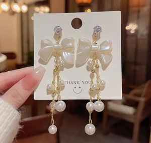 ต่างหูห้อยประดับมุกสีขาวรูปโบว์สไตล์เกาหลี ดีไซน์หรูหรา สำหรับผู้หญิง ราคาส่งถูก - Product Image 2