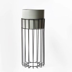 Sophisticated metal <b>textured</b> grey ceramic look planter on minimal black stand, available at wholesale prices. - Product Image 1