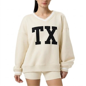 เสื้อสเวตเชิ้ตผู้หญิงคุณภาพสูง คอวีทรงโอเวอร์ไซส์ พิมพ์ลายตัวอักษร TX ไหล่ตก แขนยาว สีครีม ผ้าฝ้าย 100% เหมาะสำหรับใส่ในฤดูใบไม้ร่วง - Product Image 1